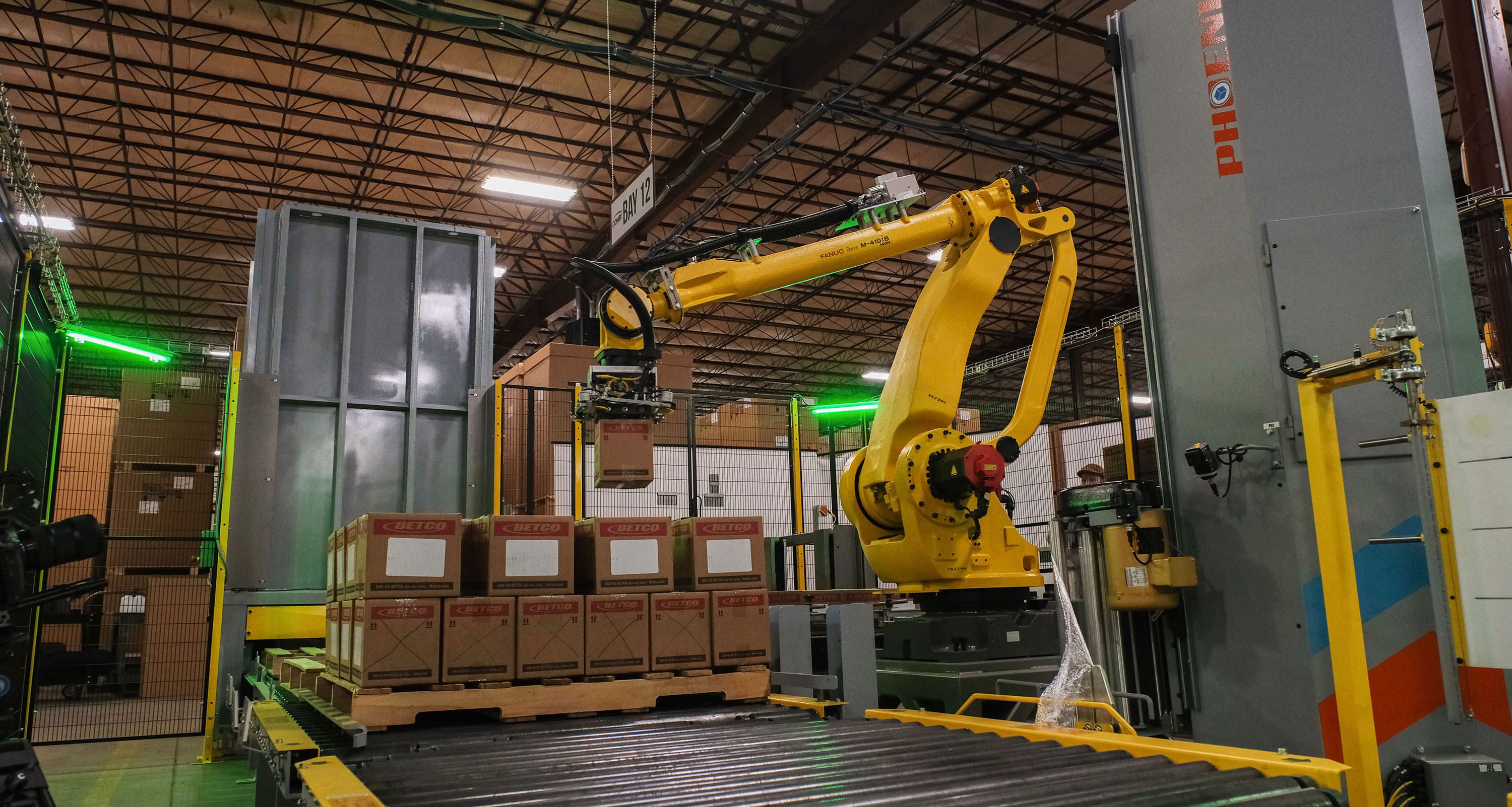 A robot stacking cartons onto a pallet